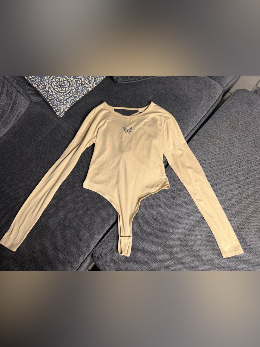 Women's Long-Sleeve Cream Bodysuit with Butterfly Detail